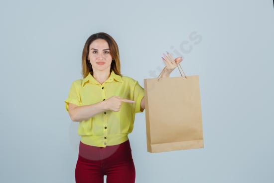 Dynamic portrait of a young woman posing expressively in a studio setting, showcasing emotions and energy through her unique style and gestures