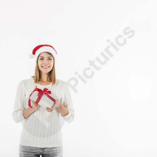 Smiling woman holding a small gift box, perfect for holiday, celebration, and festive-themed designs.