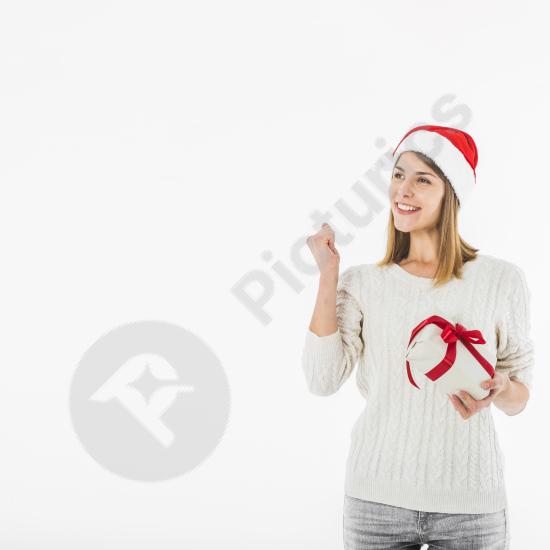 Cheerful woman holding a gift box and posing confidently, perfect for holiday, celebration, and festive-themed designs.