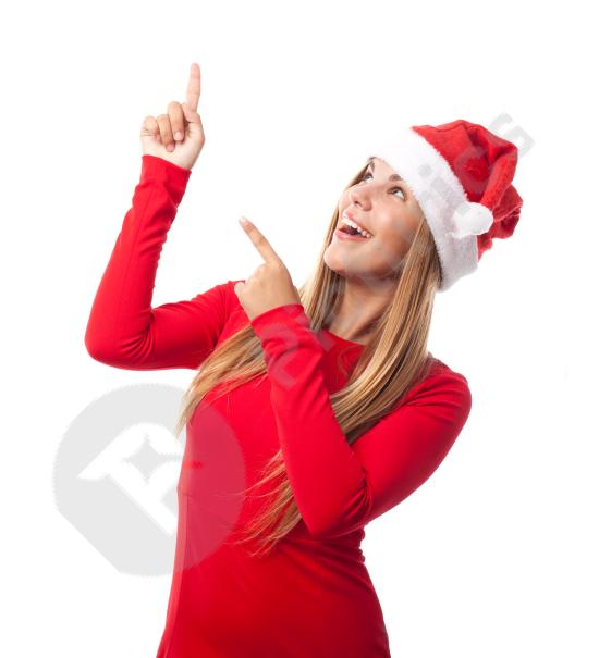 Cheerful teen wearing a Santa hat and looking up with a festive expression, ideal for Christmas and holiday-themed designs.