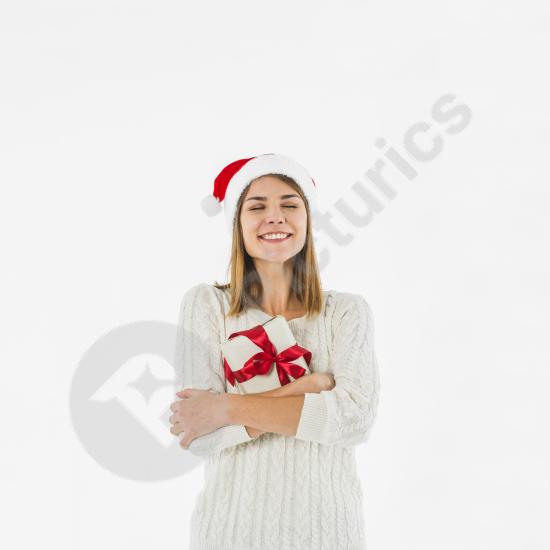 Young woman happily hugging a gift box, perfect for holiday promotions, celebration themes, and festive marketing designs.