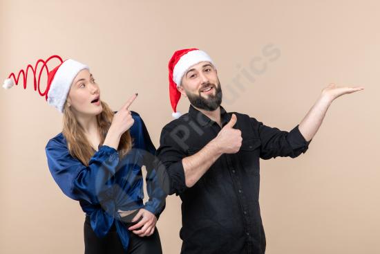 Front view of a young woman and man showing different emotions against a pink background, ideal for lifestyle, relationship, and emotional concept des...