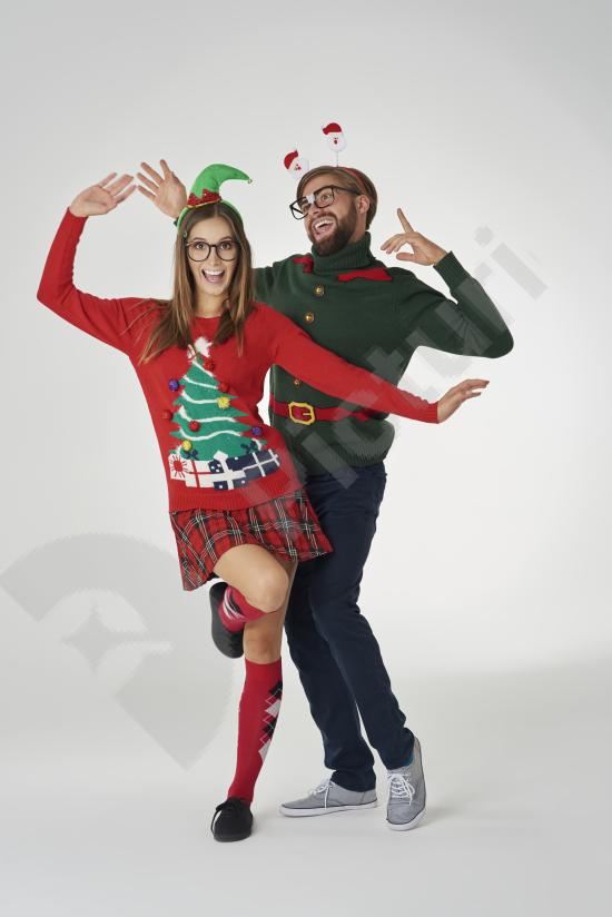 Nerdy couple posing together against a gray wall, perfect for lifestyle concepts, friendship themes, casual fashion, and fun character visuals.