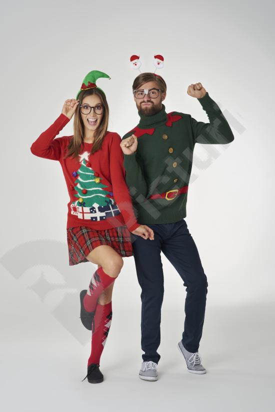 Happy dancing couple posing against a white background, ideal for lifestyle, love, celebration, and energetic movement concepts.