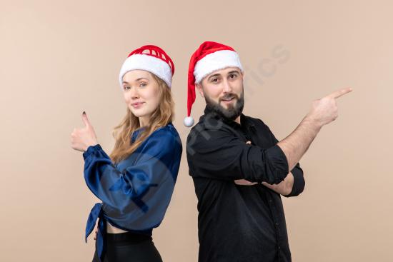 Front view of a young woman and man expressing different emotions against a pink background, ideal for lifestyle, relationship, and emotional concepts...
