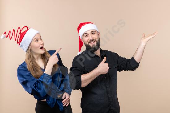 Front view of a young woman and man expressing different emotions against a pink wall, ideal for lifestyle, relationship, and emotion concept designs.