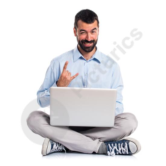 Man with a laptop making a horn gesture, expressing confidence, attitude, success, and a bold modern digital lifestyle.