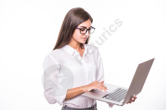 Gorgeous young student using a laptop computer, representing online education, studying, learning, and modern digital lifestyle.