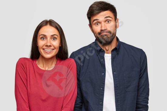 Puzzled young woman and man looking at the camera with doubtful expressions, representing uncertainty, decision making, and confusion.