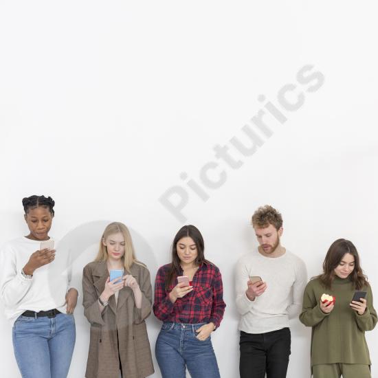 Group of friends using mobile phones with copy space, ideal for communication, social media, technology, and modern lifestyle concepts.