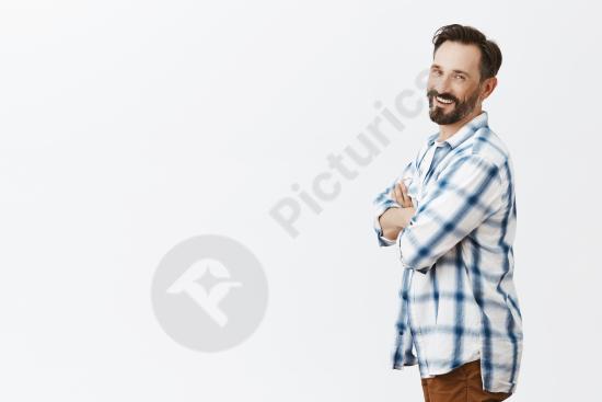 Profile portrait of a smiling bearded mature man posing confidently, suitable for lifestyle, business, personal growth, or modern portrait concepts.