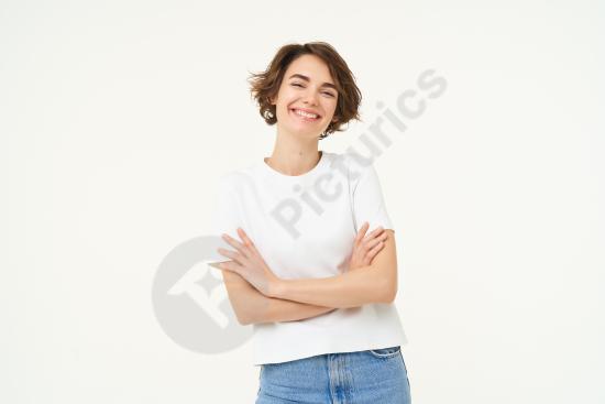 Portrait of a cheerful woman laughing and smiling with arms crossed in a confident power pose, suitable for business, leadership, or lifestyle concept...