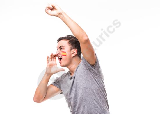 Portrait of a passionate Spain football fan screaming and cheering in support of the national team, expressing excitement and team spirit on a white b...