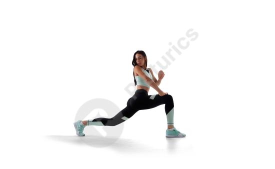 Portrait of a female athlete isolated on white background, concept of fitness, strength, training, and healthy active lifestyle.