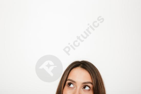 Mystery brunette woman showing half of her face and looking away. Minimal studio portrait with elegant mood, perfect for beauty and concept photograph...